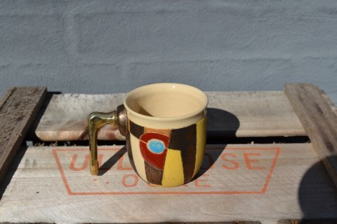 Mug with metalhandle