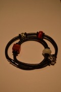 Leather bracelet in rustred/orange colours